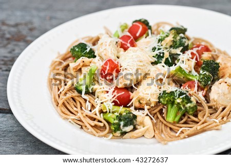 Parmesan Chicken and Broccoli served over whole wheat pasta
