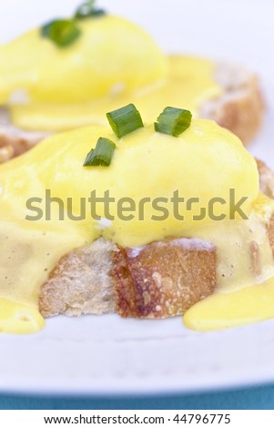 Eggs Benedict on toast with creamy hollandaise sauce.