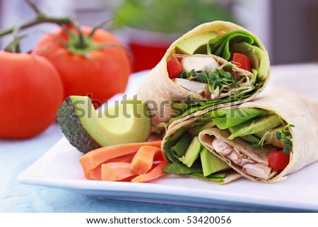 Vegan sandwich wrap with Lavish bread made from flax, oats and whole wheat. Stuffed with fresh spinach, sprouts, mushrooms, red peppers and avocados for a healthy lunch.