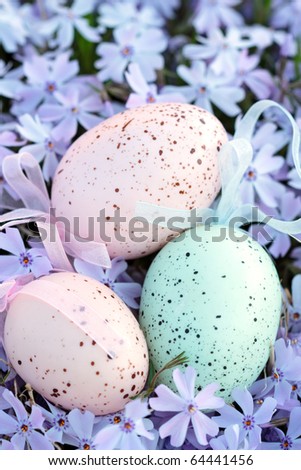 decorated easter eggs clipart. stock photo : Three beautifully decorated Easter eggs lying in a bed of phlox. Shallow