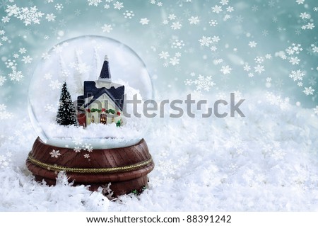 Snow globe with church and christmas trees inside. Copy space available.