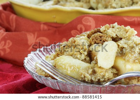 Freshly baked apple crisp. Shallow depth of field with selective focus on the foreground.
