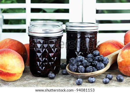 Homemade canned blueberry peach preserves with fresh blueberries and peaches.