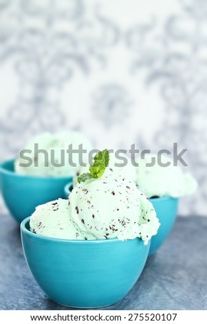 Three bowls of delicious chocolate chip mint ice cream with extreme shallow depth of field.
