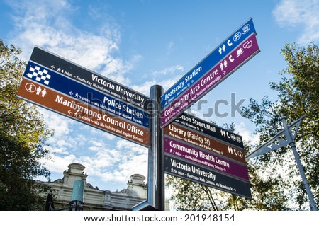 MELBOURNE, AUSTRALIA - JUNE 21, 2014: sign post in Footscray, an inner western suburb of Melbourne, pointing to major local institutions and facilities such as Victoria University.
