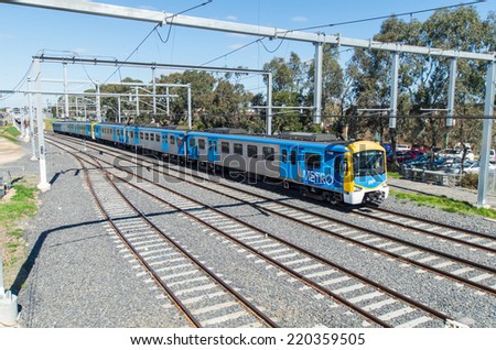 MELBOURNE, AUSTRALIA -  September 21, 2014: local Metro train near Springvale train station. Majority-owned by Hong Kong\'s MTR Corporation, Metro moves 228 million passengers every year.