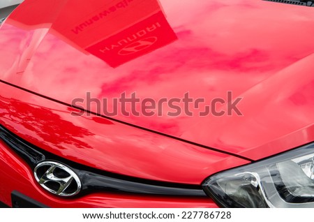 MELBOURNE, AUSTRALIA - November 2, 2014: details of a Hyundai car in a car dealership, with the dealer's sign reflected in the bonnet. Hyundai is a large South Korean car manufacturer.