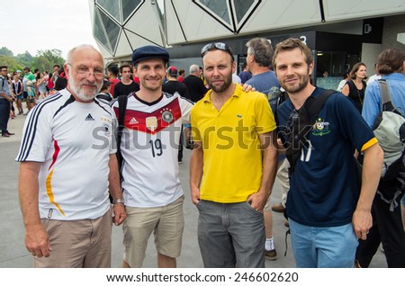 MELBOURNE, AUSTRALIA - January 22, 2015: German and Australian (Socceroos) football fans in national shirts outside the Melbourne Rectangular Stadium before an AFC Asian Cup match.