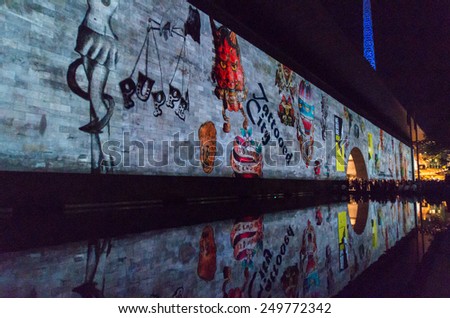 MELBOURNE, AUSTRALIA - February 22, 2014: projections of images of tattoos and tattooed people onto the National Gallery of Victoria (NGV) during the White Night arts festival.