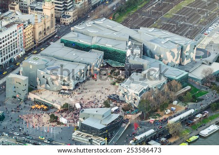 MELBOURNE, AUSTRALIA - September 6, 2014: Federation Square is an activity hub in Melbourne, with restaurants, the National Gallery of Victoria and a giant television screen. It hosts many festivals.