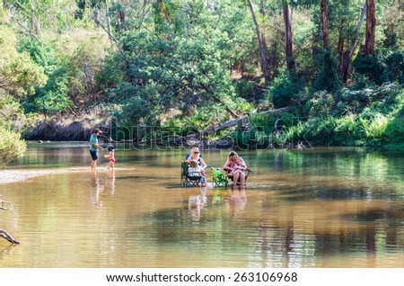MELBOURNE, AUSTRALIA - March 22, 2015: a family enjoying the Yarra River in outer suburban Warrandyte on a warm autumn day.