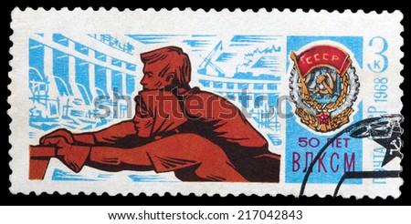 USSR - CIRCA 1968: A stamp printed in USSR, shows young workers and Order of Lenin, devoted to the 50-th anniversary of Komsomol, circa 1968