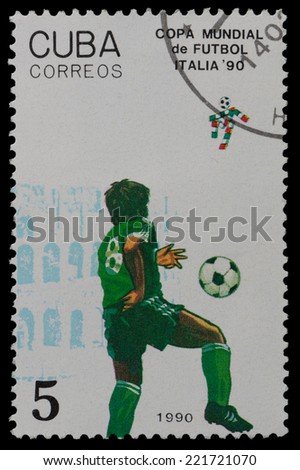 CUBA - CIRCA 1990: a stamp printed by CUBA shows football players. World football cup in Italy,  circa 1990