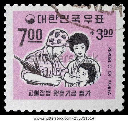 KOREA - CIRCA 1958: post stamp printed in KOREA shows Korean soldier reunited with his family, circa 1958