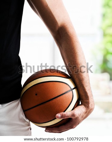 Basketball player holding a basket ball