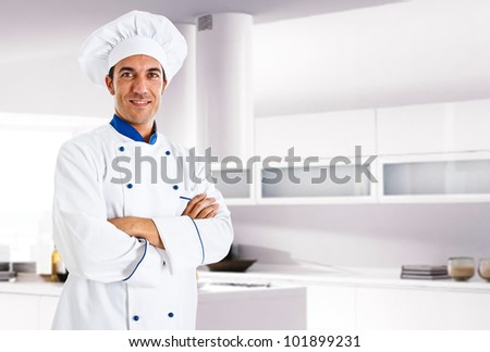 Portrait of an handsome italian chef in his kitchen