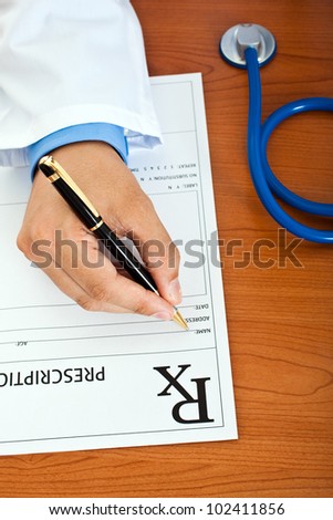 Closeup shot of a doctor writing a medical recipe