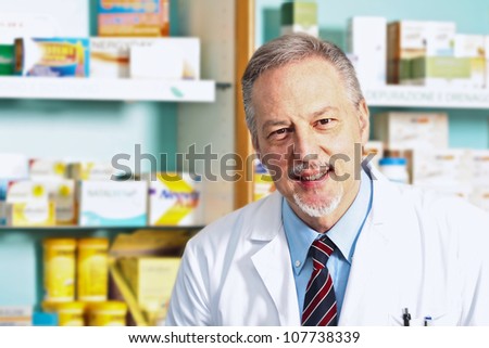 Portrait of an handsome senior pharmacist in his shop
