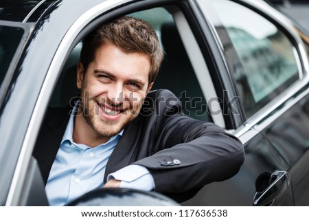 Portrait Of An Handsome Guy Driving His Car
