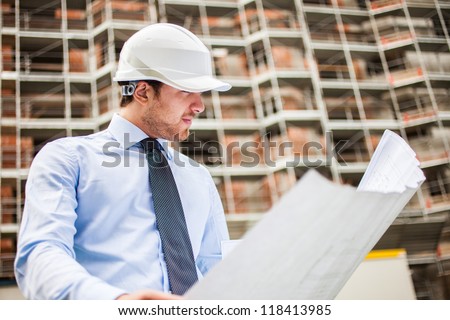 Portrait of an architect in front of a construction site