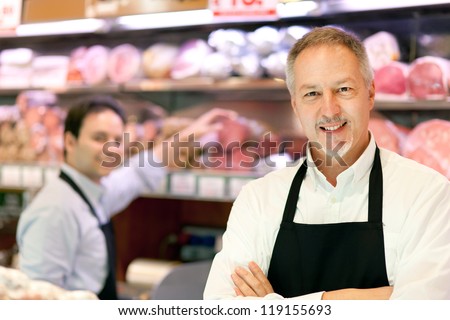 Butchers In A Supermarket At Work