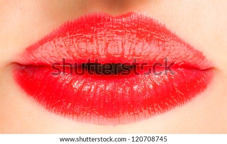 Female mouth with red lipstick macro