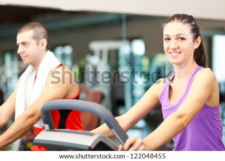 People in the gym doing indoor biking
