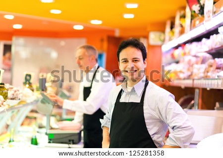 Butchers in a supermarket at work