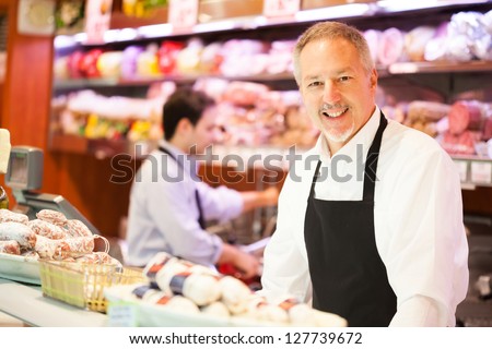 Shopkeepers at work in a grocery store