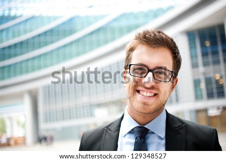 Portrait of an handsome businessman in an urban setting Portrait of an handsome businessman in an urban setting