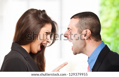 Two persons yelling out to each other