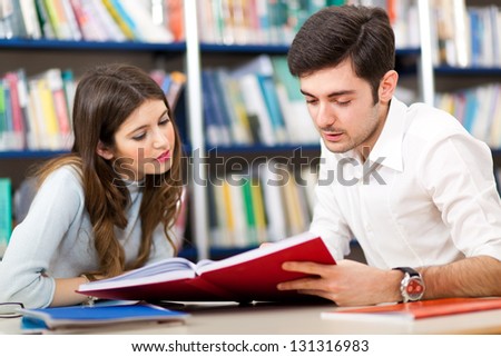 People Studying Together In A Library