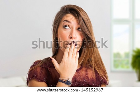 Young woman shutting her mouth