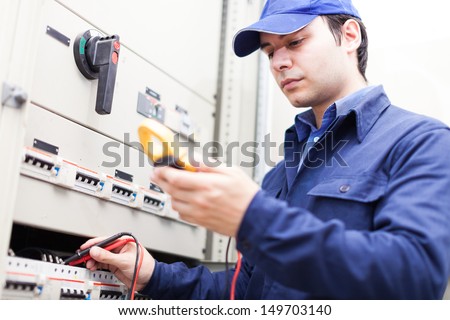 Portrait Of An Electrician At Work