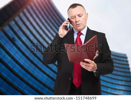 Businessman talking on the phone in an urban setting