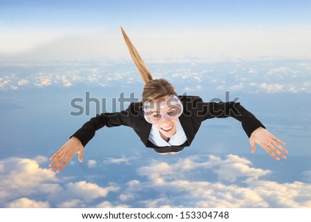 Portrait of funny business woman skydiving