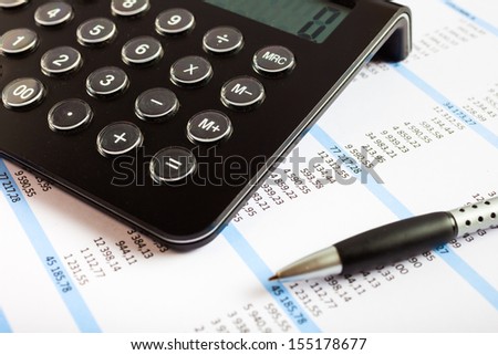 Accounting concept: pen, calculator and paperwork