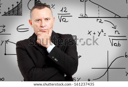 People writing formulas on a white wall