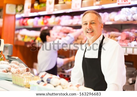 People at work in a grocery store