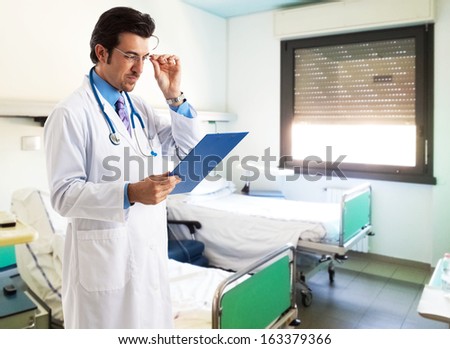 Doctor reading a case history