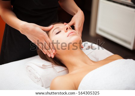 Beautiful woman having a facial massage Beautiful woman having a facial massage