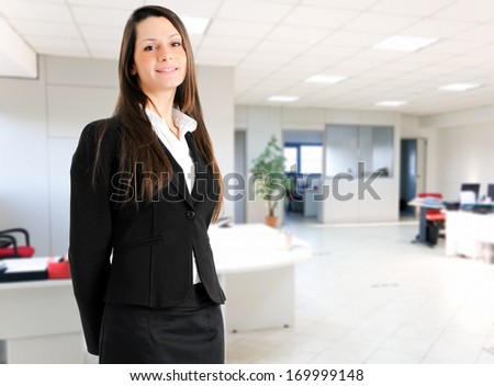 Beautiful young businesswoman portrait in a modern office