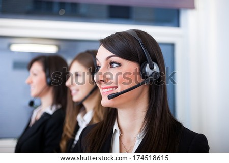 Portrait Of A Smiling Customer Representatives At Work