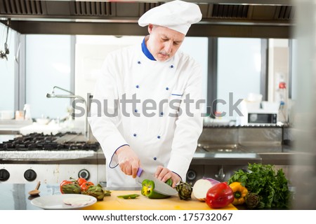 Chef preparing vegetables in his kitchen