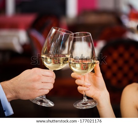 Couple Toasting Wine Glasses