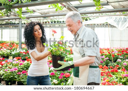 Florist selling flowers to a customer