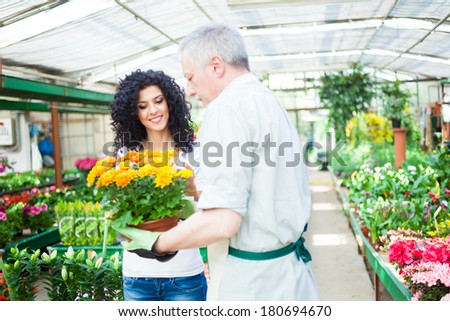 Florist selling flowers to a customer