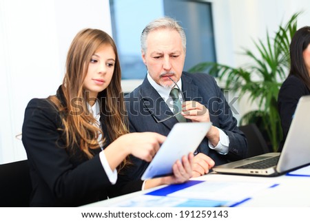 Business people at work in their office