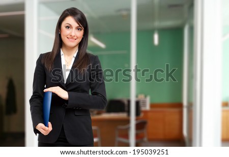 Smiling young female manager in the office