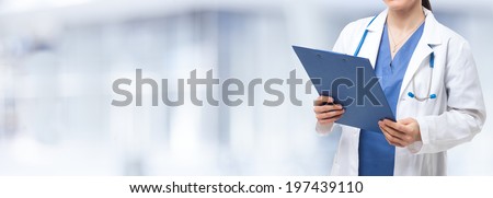 Detail of a nurse holding a clipboard